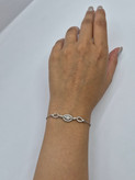 دستبند نقره زنانه طرح سه حلقه ی نگیندار با قطعه مرکزی بزرگ